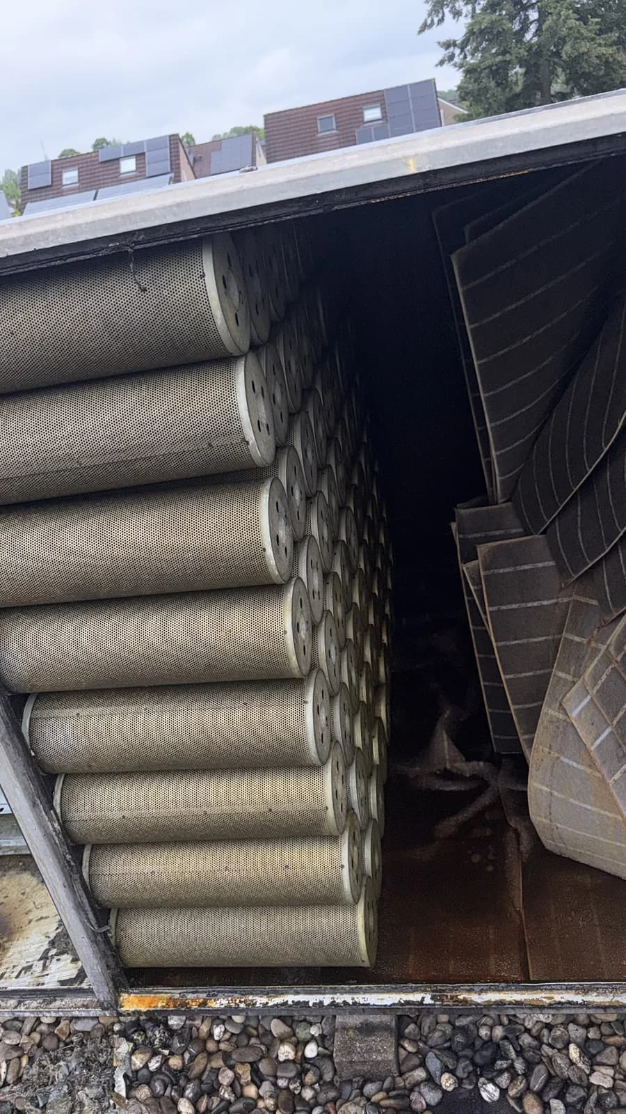 Large rooftop installation with stacked carbon cylinders and pre-filter panels.