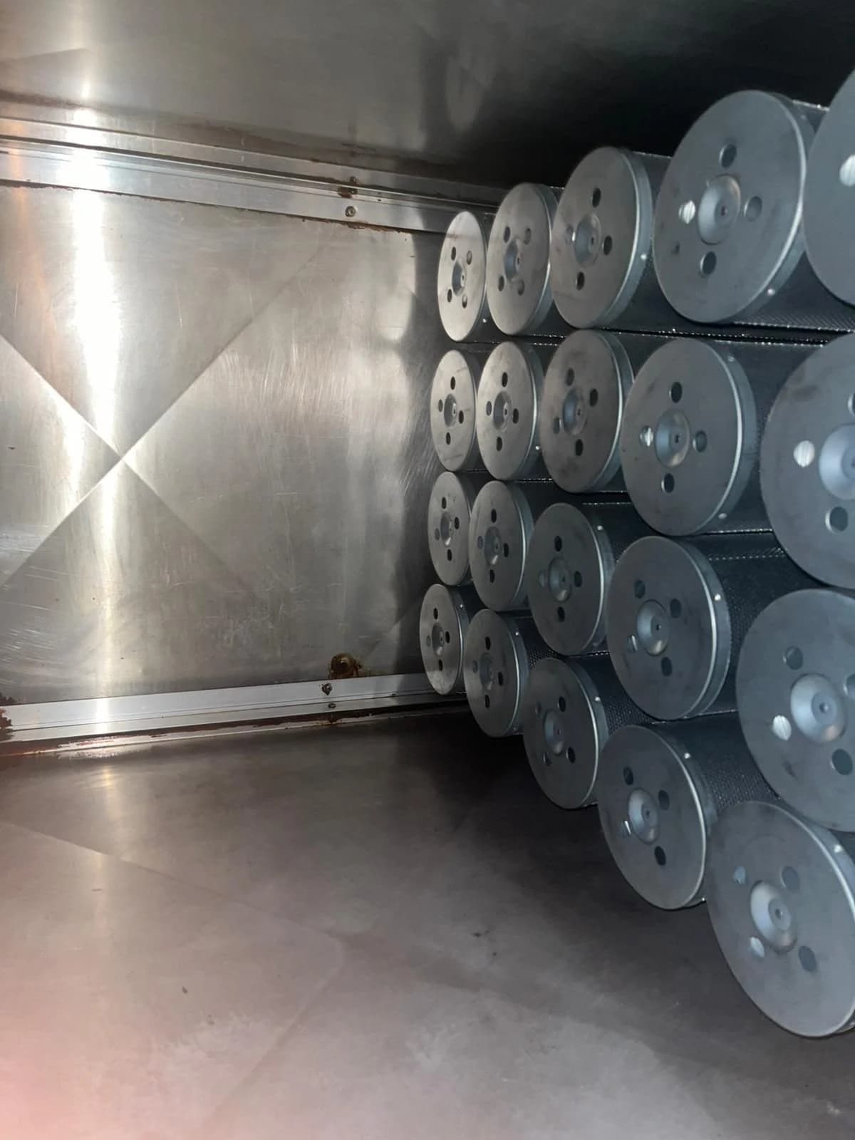 Overview of mounted carbon filter cylinders on the mounting wall inside the technical room.
