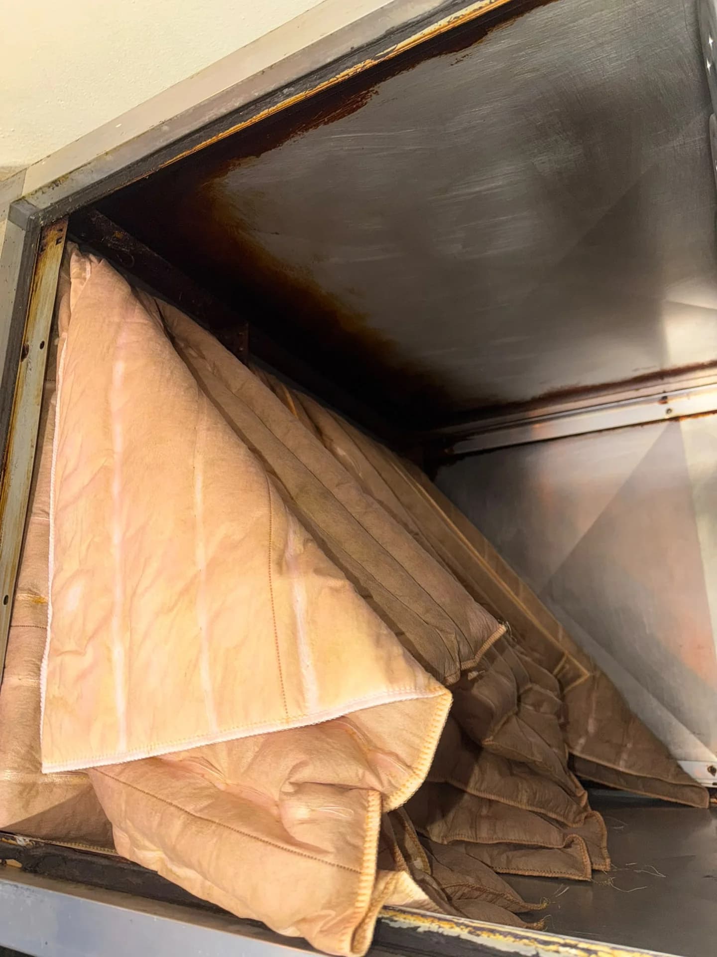 Heavily contaminated and saturated pocket filter removed during scheduled maintenance.